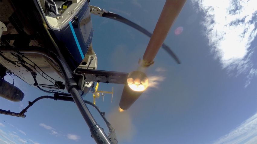 A Thales FZ90 70 mm/2.75” rocket motor body is fired from an Arnold Defense M260 air launcher mounted on a Bell 407 utility helicopter during qualification tests at Dillon Aero’s test range near Maricopa, Arizona in January. (Arnold Defense)