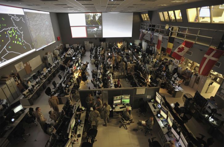 US and coalition forces at the Combined Air Operations Center (CAOC), Al Udeid Air Base, Qatar. (US Department of Defense)