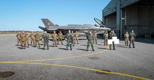 One of the four Italian Air Force F-35As that recently arrived at Amari Air Base in Estonia, alongside some of the service personnel that will conduct the type's first operation in support of the NATO Baltic Air Policing mission.