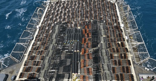 The seized weapons displayed on USS 
        
        's flight deck.