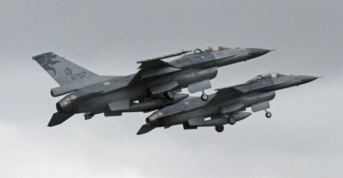 Two RoCAF F-16 fighters taking off from Hualien airbase in January 2013. The MND in Taipei signed a TWD291 million (USD10.4 million) contract with the AIT for follow-on support and maintenance of US-made missiles deployed with the island's F-16s.