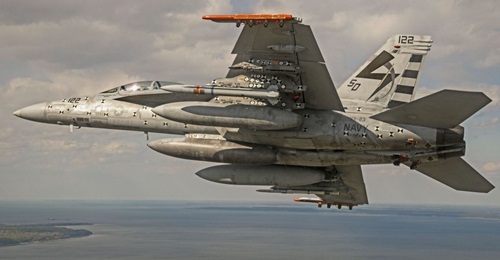 A US Navy F/A-18E/F Super Hornet conducts a captive-carriage flight with an Advanced Anti-Radiation Guided Missile - Extended Range (AARGM-ER) Separation Test Vehicle at the Naval Air Warfare Center Atlantic Test Ranges in Patuxent River, Maryland, on ...