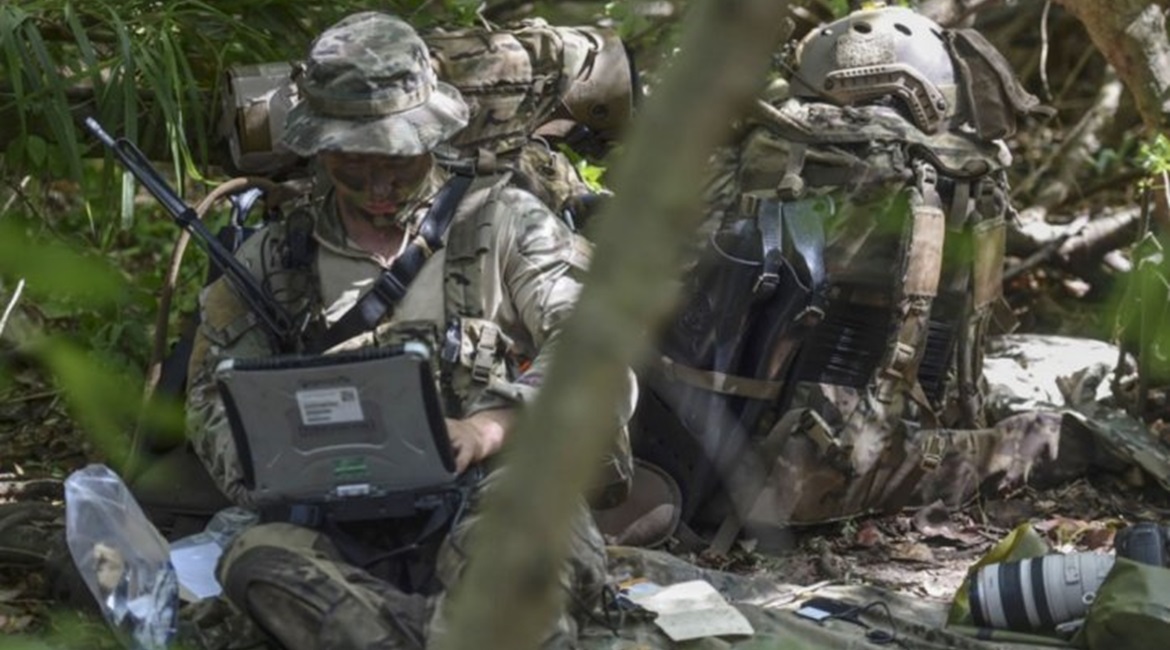 A US Air Force Special Operations weather technician sends intelligence to the National Reconnaissance Operations Center during the Marine's Reconnaissance Team Leader Course's final exercise on 31 Oct 2017.