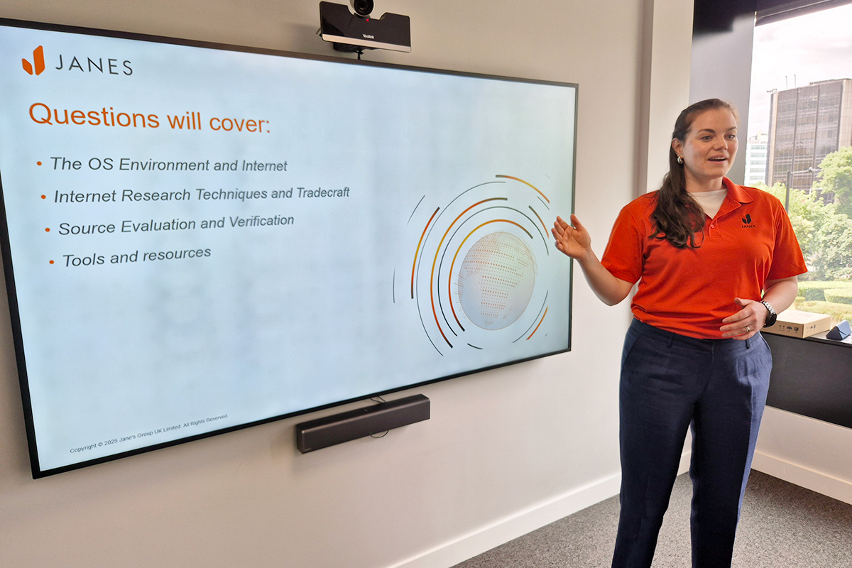 Image of of Janes OSINT Tradecraft tutor presenting in-person in front of large display screen